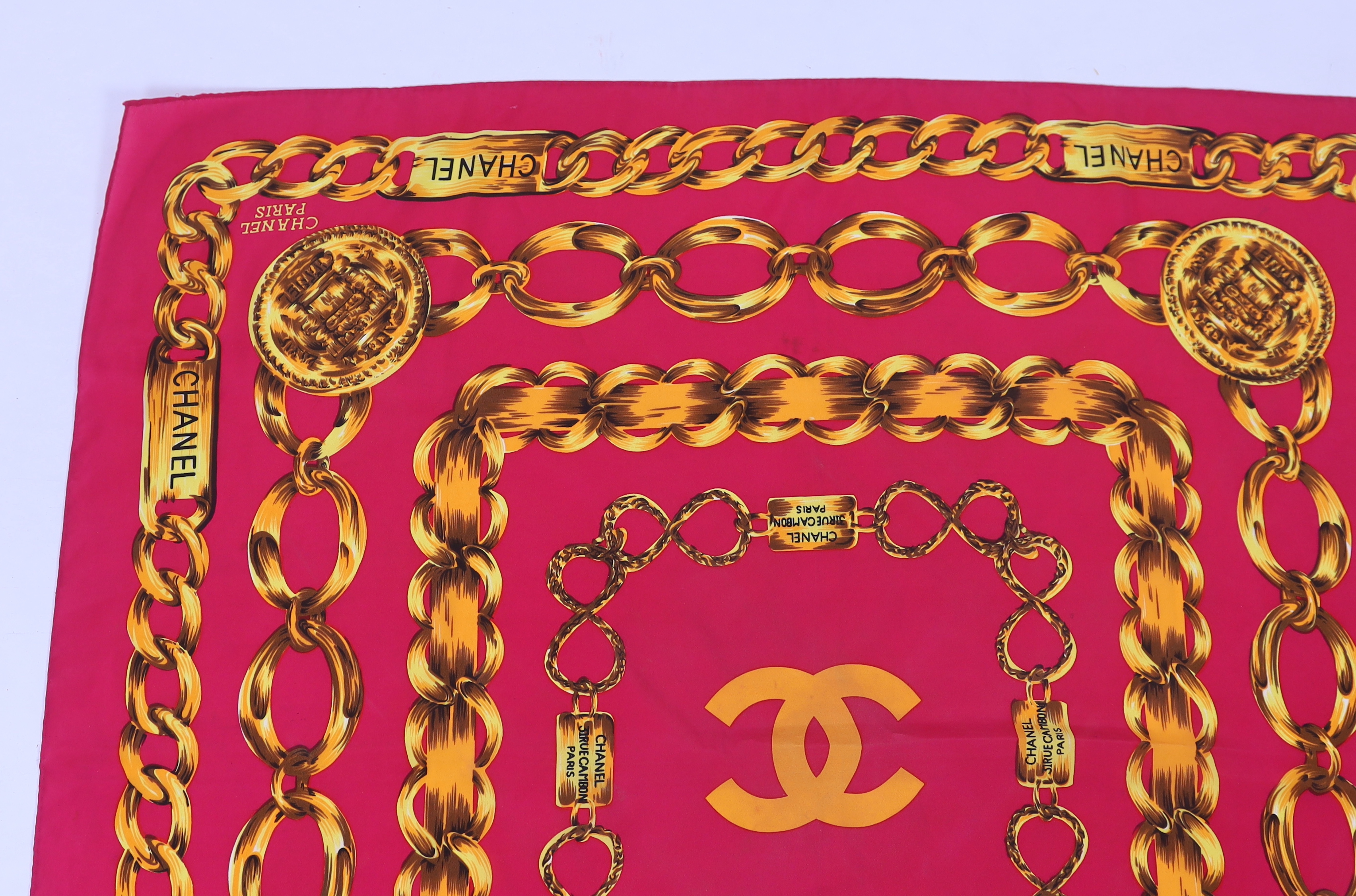 A Chanel Chain pink and gold silk scarf, 80cm x 80cm